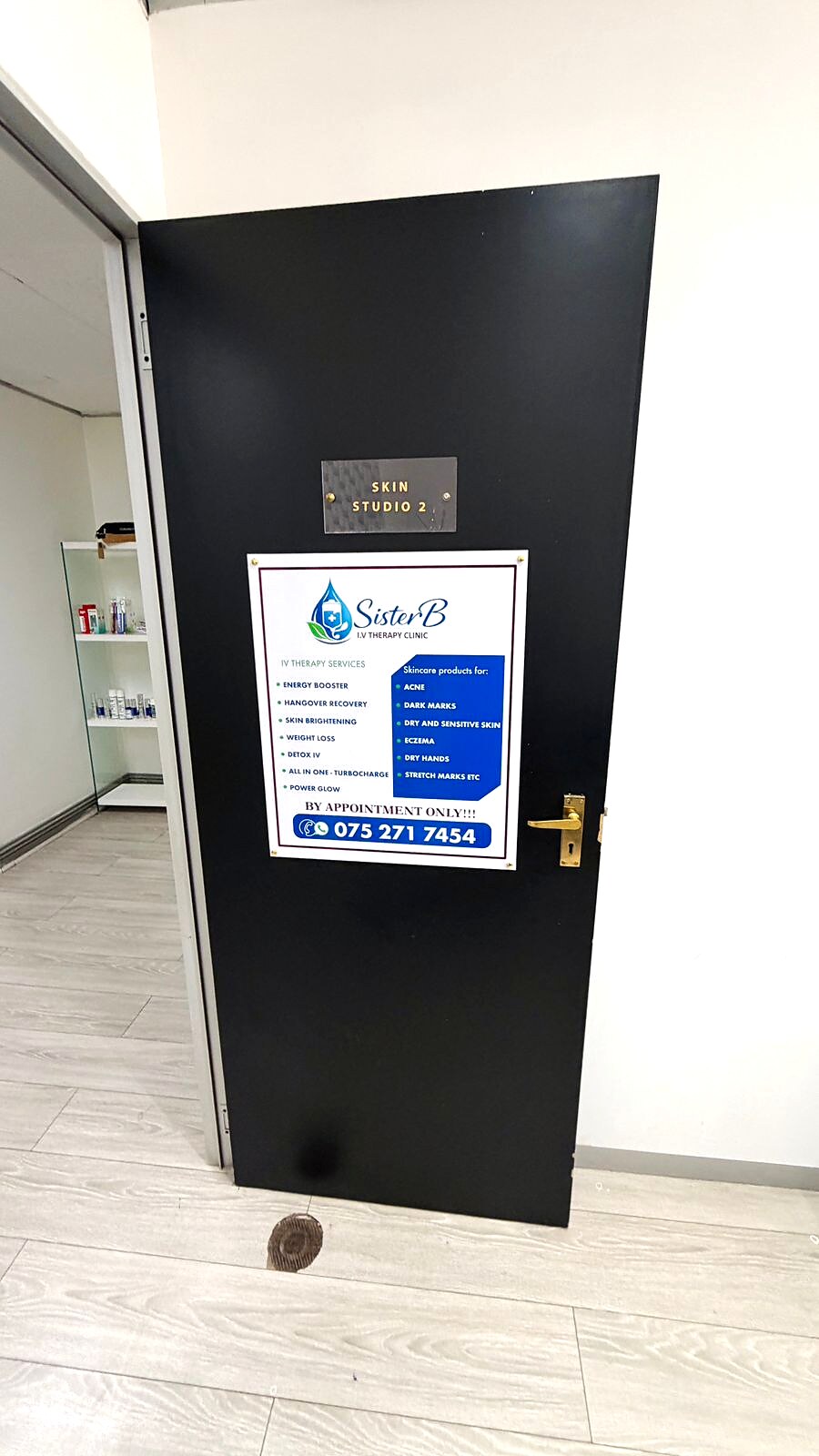 Sister B I.V Therapy Clinic services poster on the Lonehill treatment studio door